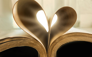Book with hart shape made of pages, vintage effect style pictures
