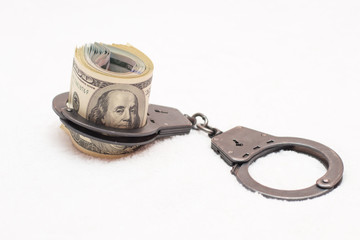 Money dollars and manacles isolated on white background