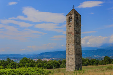 the solitary medieval stone bell tower of Saint Martin called "The Ciucarun" located in Bollengo,Italy /It is the only remaining remnant of the ancient village of Paerno demolished in the 1250s
