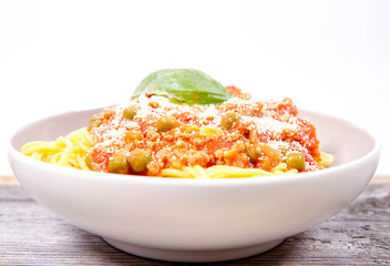 Spaghetti bolognese with pea (Gluten-free pasta made of corn)