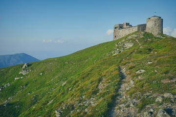 Fototapeta na wymiar The old observatory on Mount Pip Ivan in Carpathians