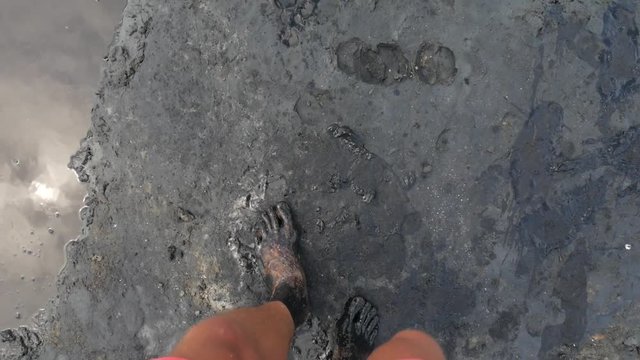 Man with Dirty Feet Walking Barefooted near Salty Lake Pond. HD Slowmotion POV.