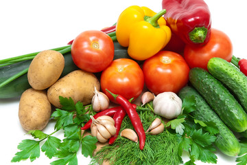 Vegetables and greens on a white background.