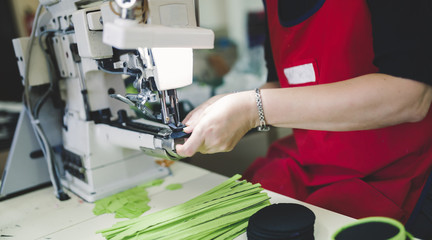Worker in textile industry sewing