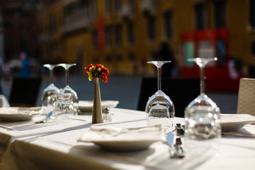 Inverted empty wine glasses on the table, toning