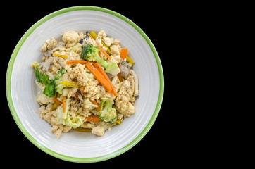 Thai food stir fry vegetables isolated on black background.