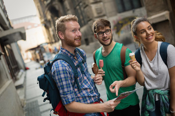 Tourist friends discovering city on foot