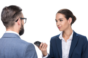 female journalist taking interview with businessman, isolated on white