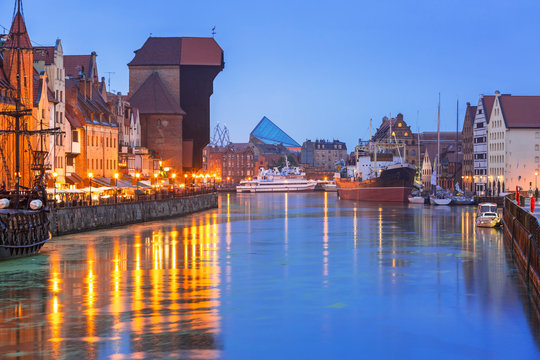 Historic port crane over Motlawa river in Gdansk at night, Poland