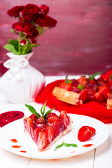 Strawberry pie on white plate and white wooden table. One piece.  Romantic. Love. Heart.