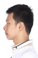 Fototapeta premium Asian man before make up hair style. no retouch, fresh face with nice and smooth skin in white polo shirt. Studio lighting white background