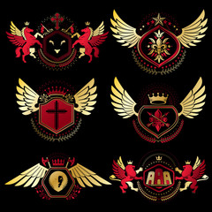 Heraldic vector signs decorated with vintage elements, monarch crowns, religious crosses, armory and animals. Set of classy symbolic graphic insignias with bird wings.