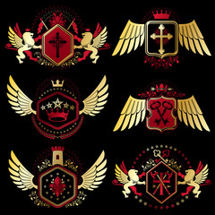 Heraldic vector signs decorated with vintage elements, monarch crowns, religious crosses, armory and animals. Set of classy symbolic graphic insignias with bird wings.