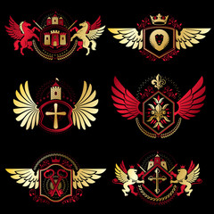 Heraldic vector signs decorated with vintage elements, monarch crowns, religious crosses, armory and animals. Set of classy symbolic graphic insignias with bird wings.