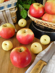 Apples and white nectarines on a wooden table. Fresh autumn harvest
