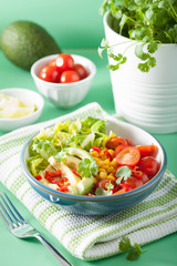 healthy vegan avocado salad with tomatoes and sweetcorn