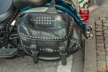 A typical biker leather bag. Motorbike accessories. Vintage effect