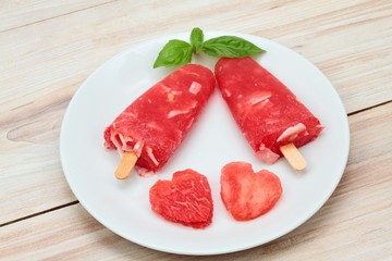 Homemade ice lolly from water melon &  almond pieces