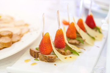 Sweet wild strawberries in plate