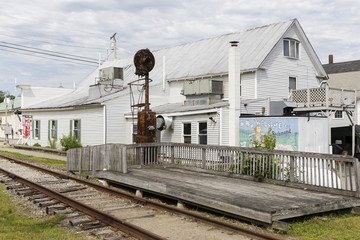 USA, Richmond, Maine. Rusted train tracks and an old wooden platform. The train doesn't seem to run here anymore for quite some time.