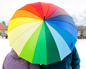 Elderly couple with colorful umbrella
