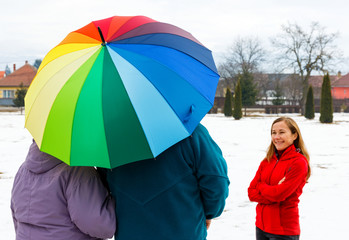 Elderly couple and young caregiver