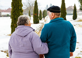 Walking elderly couple