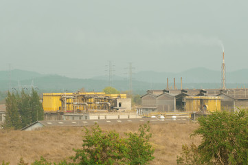 Fototapeta na wymiar Mining factory in the midst of nature.