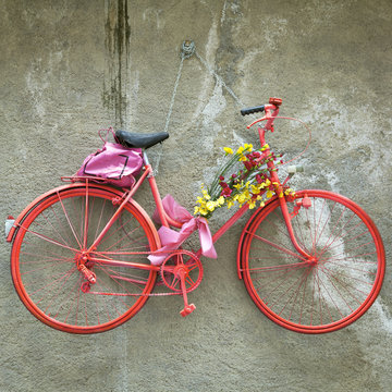 Old hanging decorative bike. Color image