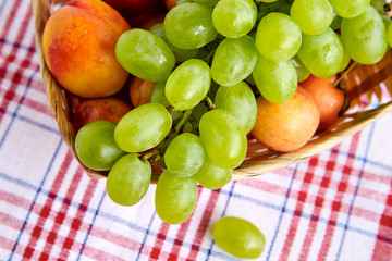 white grapes in a straw basket