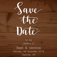 Save the date card, wedding invitation on a wooden background and letters 
