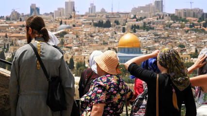 The Christian orthodox guide shows the Jerusalem Old City view to the pilgrims and tourists from...