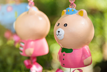 Obraz premium Colorful animal ceramic doll hanging in the garden.