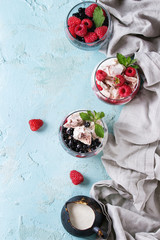 Traditional summer dessert Eton Mess. Broken meringue with whipped cream, berry jam, fresh...