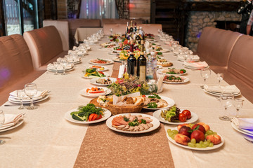 Wedding table setting. Restaurant table with food. Catering service. Wedding celebration, decoration. Dinner time