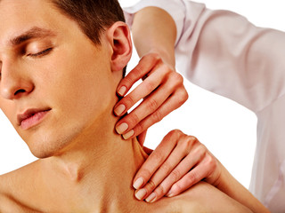Shoulder and neck massage for man in spa salon. Doctor making therapy in rehabilitation center....