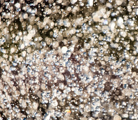 Abstract background of drops of water on the fly
