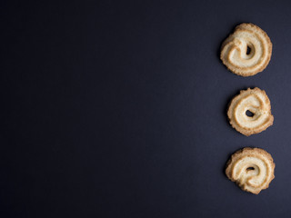 Danish vanilla wreaths cookies (vanillekranse) isolated on black background