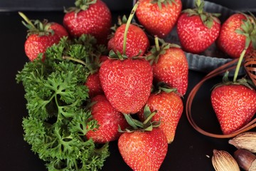 Fresh strawberries is delicious on black background
