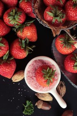 Fresh strawberries is delicious on black background