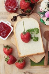Strawberry jam with slice of bread delicious