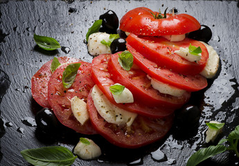 Tomatoes and mozzarella with basil.