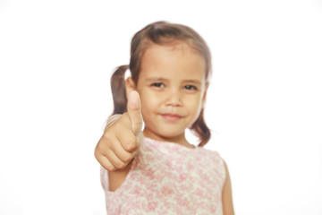 Little girl making thumbs up on white background.