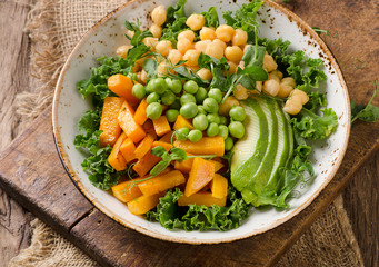 Chickpea, pumpkin and avocado vegetarian buddha bowl.