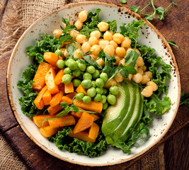 Chickpea, pumpkin and avocado vegetarian buddha bowl.