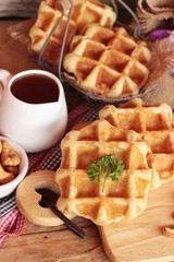Waffles topped with honey, raisins and cashews.