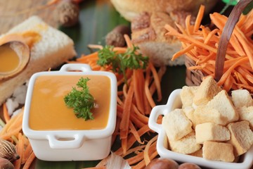 Carrot cream soup with bread is delicious