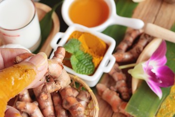 Turmeric powder with honey ,milk, salt for scrub