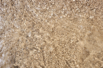 Pebbles on the beach and sea waves