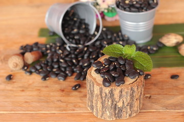 Fototapeta na wymiar Black beans for health on wood background